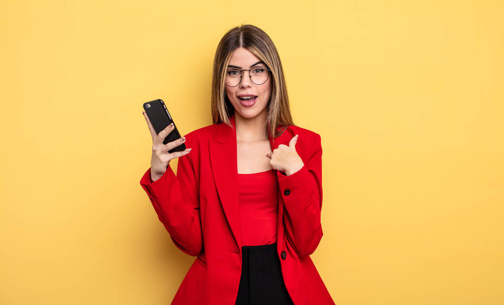 businesswoman feeling happy and pointing to self with an excited. smartphone concept - Photo, Image