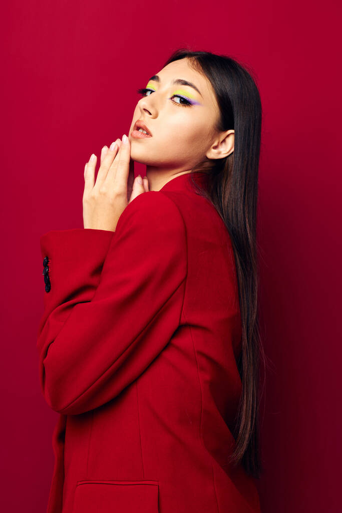 beautiful brunette fashion posing in red jacket isolated background unaltered - Photo, image