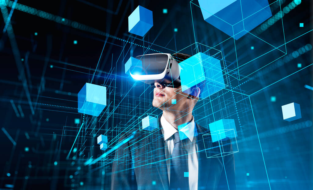 Boss businessman in vr glasses headset, digital hologram of blocks in metaverse, virtual reality and futurism. Concept of artificial intelligence and big data - 写真・画像