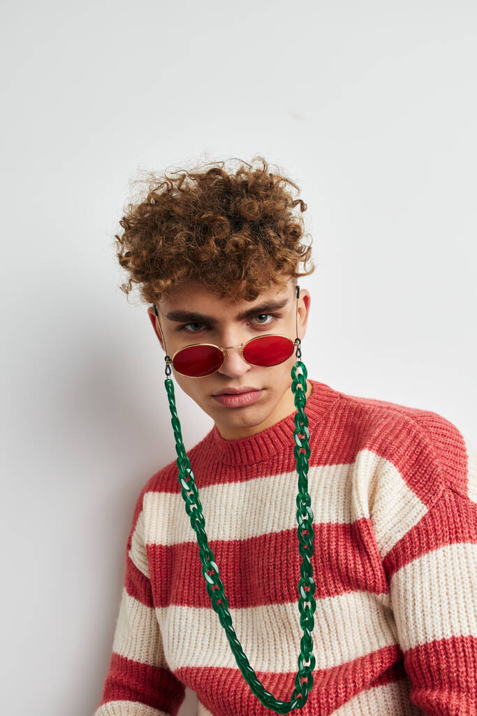 Cheerful guy with curly hair in stylish glasses posing - Foto, Imagem