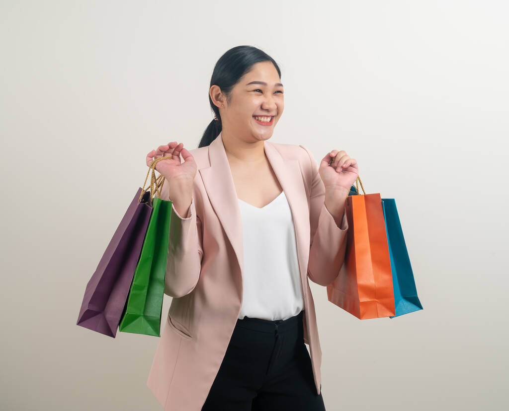 Asian woman holding shopping bag on hand with white background - Photo, Image