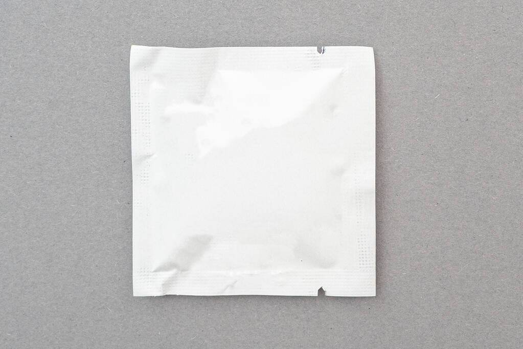 Small foil package by wet antibacterial wipe, mock up, space for text, top view - Fotoğraf, Görsel
