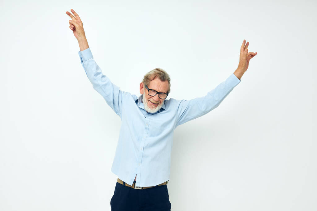 Portrait of happy senior man lifestyle posing hand gesture isolated background - Foto, Bild