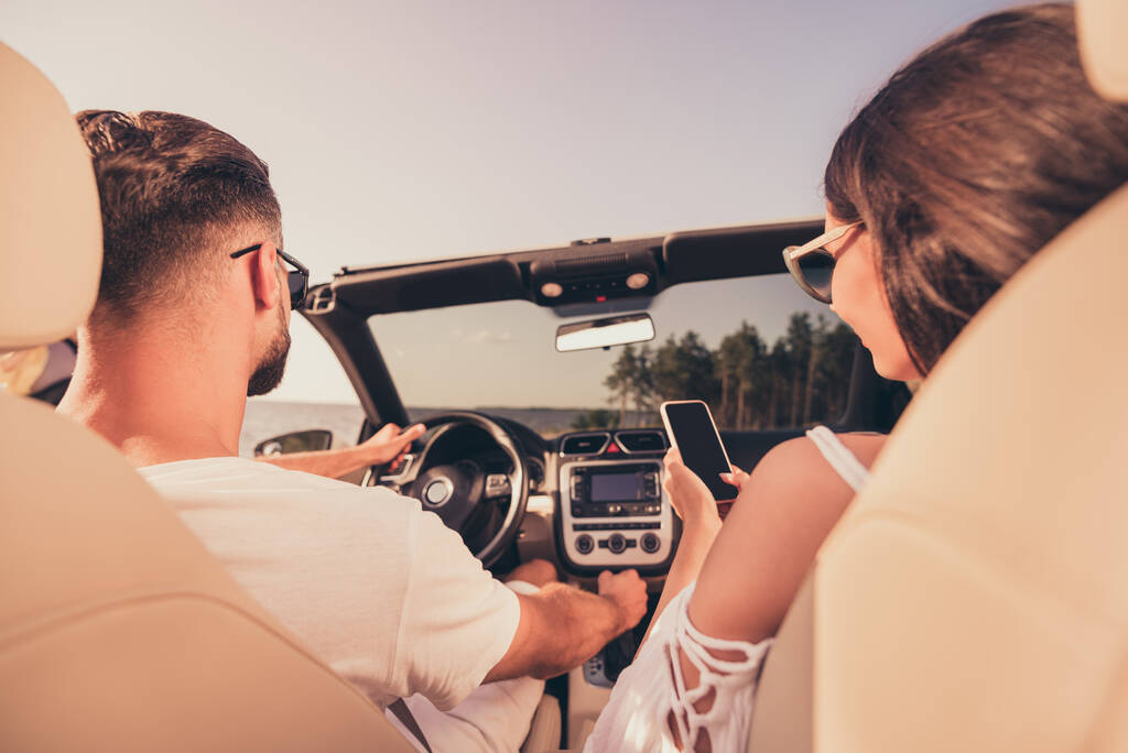 Rear back behind view portrait of attractive couple riding car spending honey moon romance fresh air relax outdoors - Photo, Image