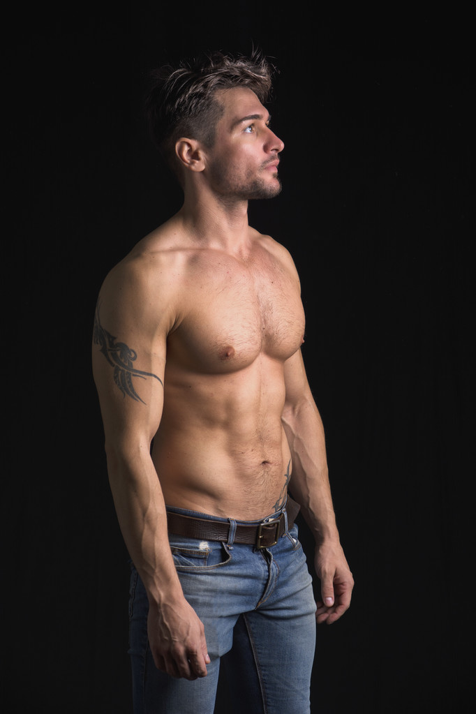 Handsome shirtless muscular man on black - Photo, Image
