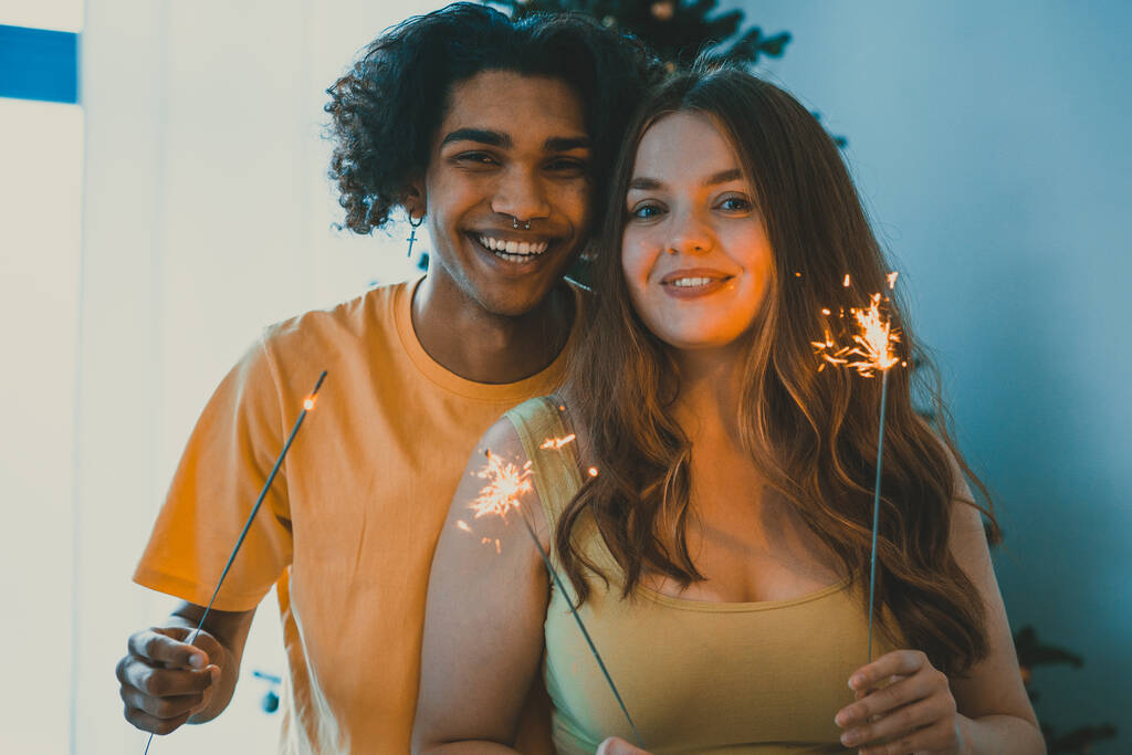 modern multiethnic unstereotyped couple celebrating holidays. Not stereotyped boyfriend and girlfriend together. True love romantic concepts - Photo, Image