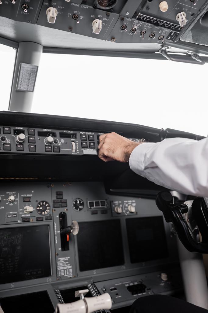 visão recortada do piloto que alcança o painel de controle no avião - Foto, Imagem