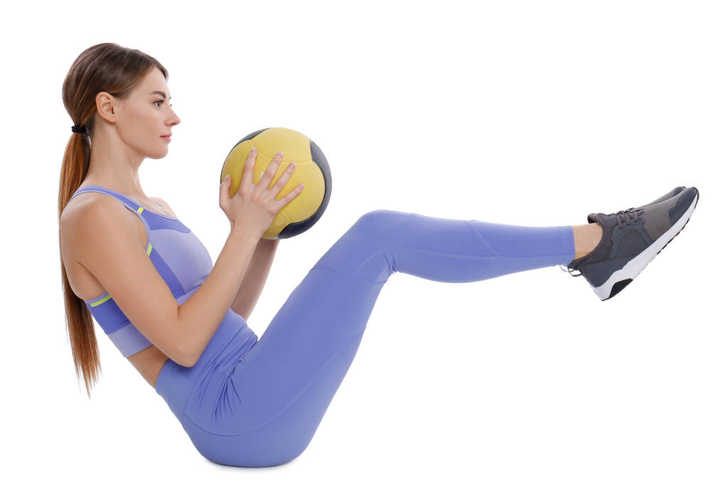 Спортсменка виконує вправи з медичним м'ячем ізольовано на білому
 - Фото, зображення