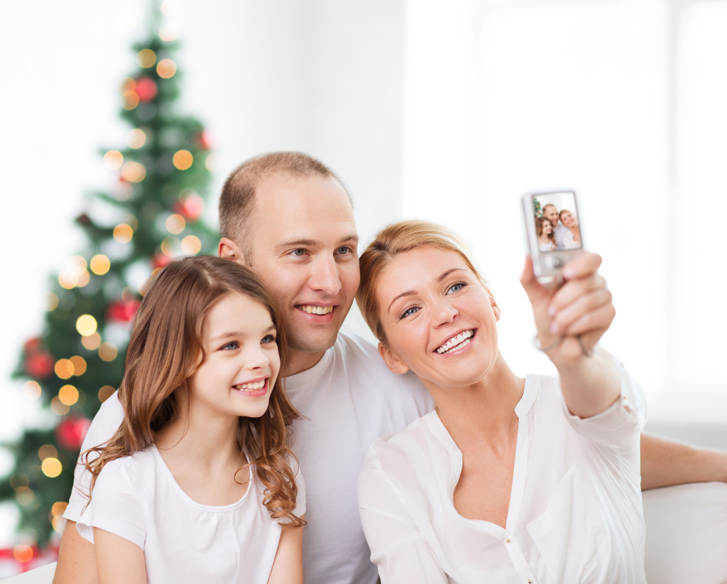 happy family with camera at home - Photo, Image