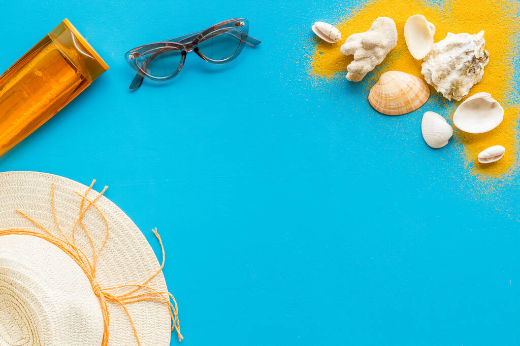 Flatlay of summer beach accessories with sand and seashells - Photo, Image