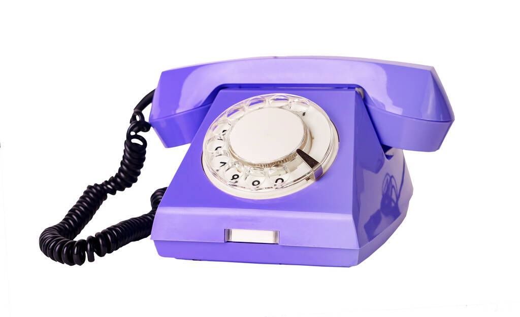 Fioletowy telefon obrotowy z kablem izoalowanym na białym tle - Zdjęcie, obraz