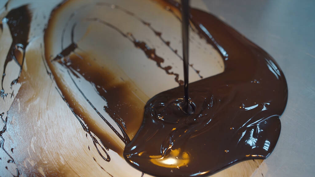 melted chocolate smeared on the table - Photo, Image
