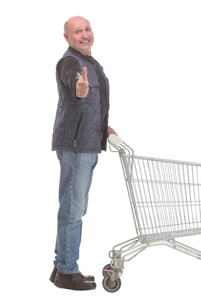 ショッピングカートと親指を持つ紳士の完全な長さの肖像画 - 写真・画像