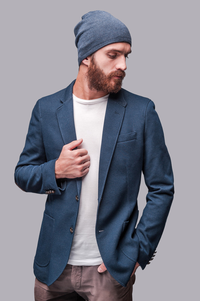 Bearded man adjusting his jacket - Photo, Image
