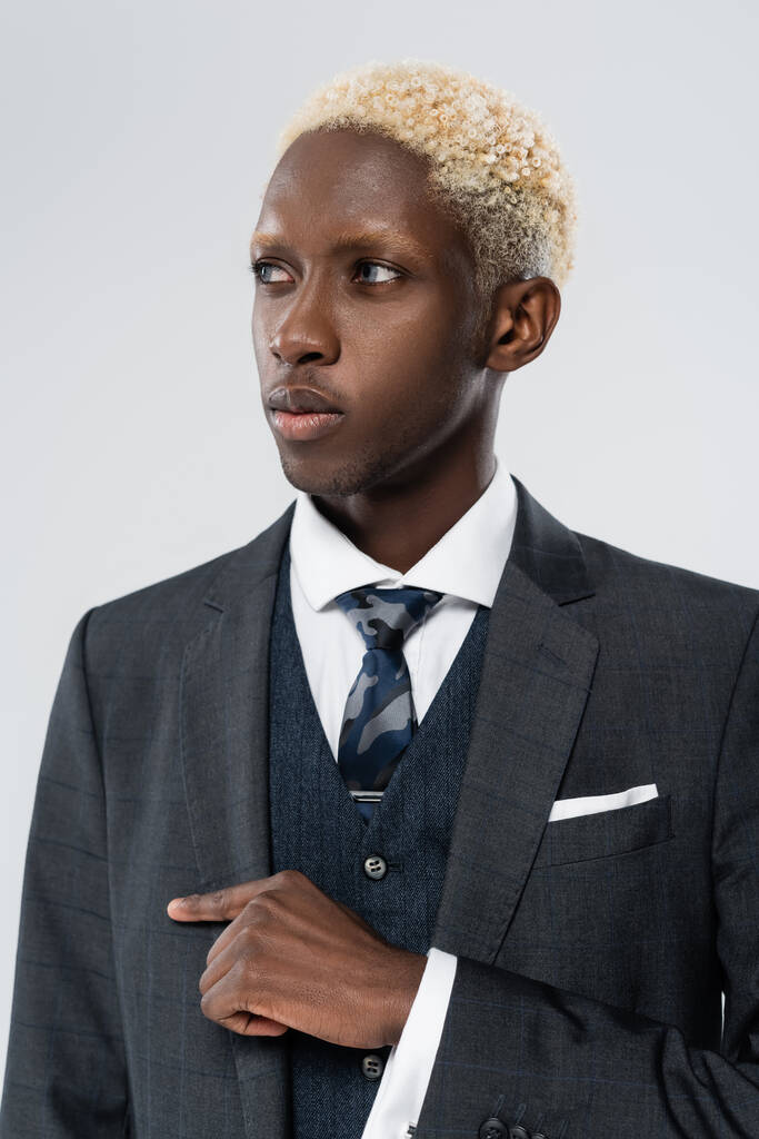 blonde african american man in formal wear isolated on gray - Photo, Image