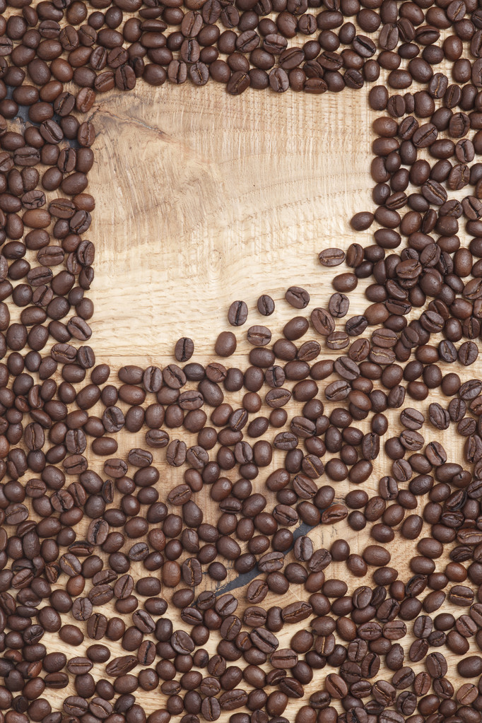 Видання кави, кавові зерна на дерев'яному фоні
 - Фото, зображення