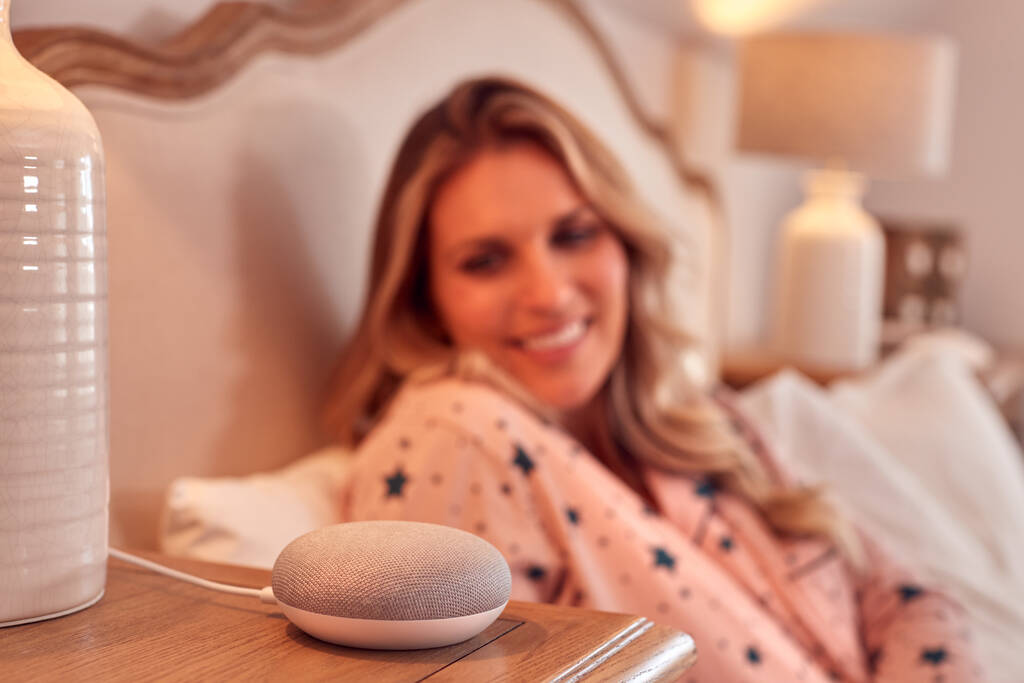 Woman At Home In Bed Using Digital Personal Assistant - Photo, Image