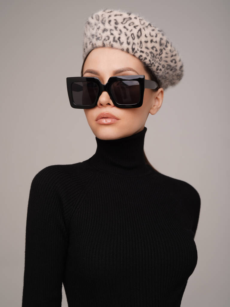 Beautiful young lady in a black turtleneck. Refined taste. Elegance. Leopard print beret - Photo, Image
