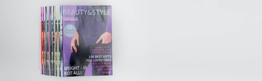 stack of beauty and style magazines isolated on grey, top view, banner - Photo, Image