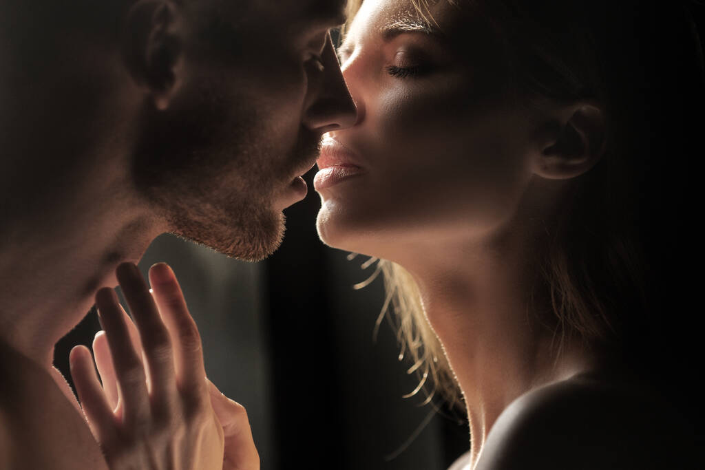 Couple in love face to face, tender hugging and kissing. Beautiful woman and handsome man boyfriend. Sensual couple kiss. I love you. Romantic and love. - Photo, Image