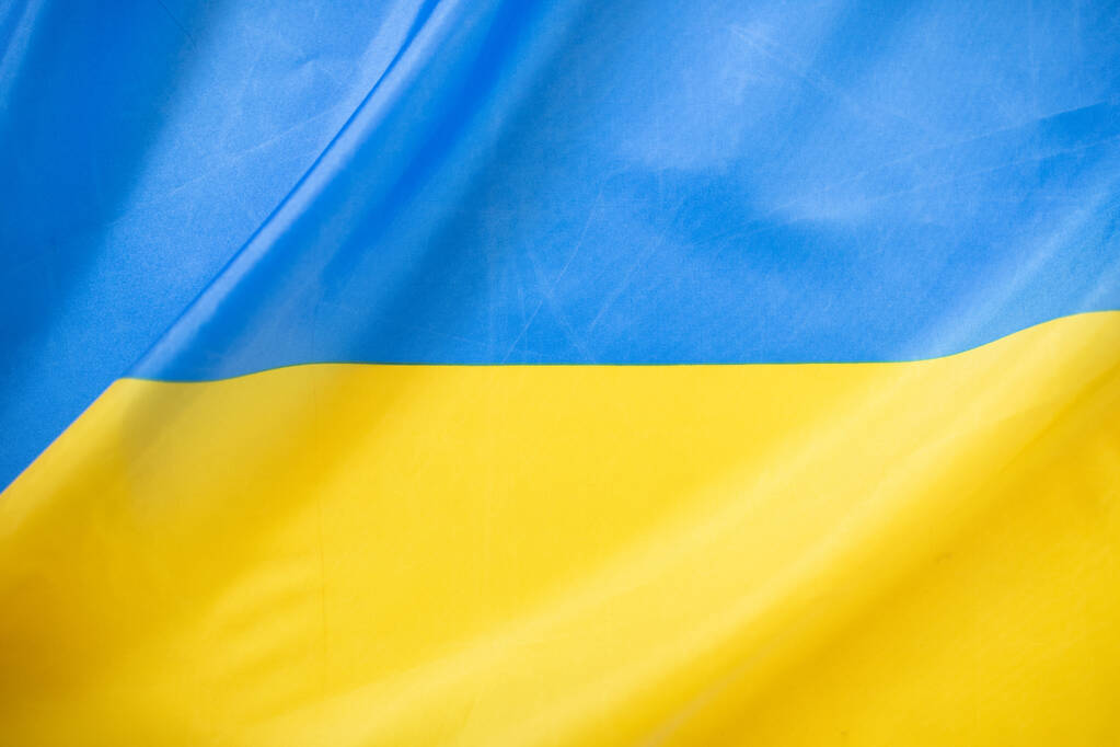 Ukrajna zászlója, UA. Kék és sárga színek. Közelkép, háttér - Fotó, kép