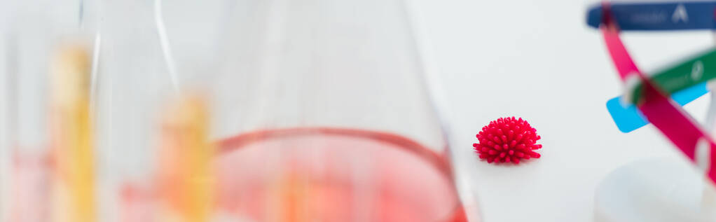 red coronavirus bacteria in bio laboratory on blurred foreground, banner - Photo, Image