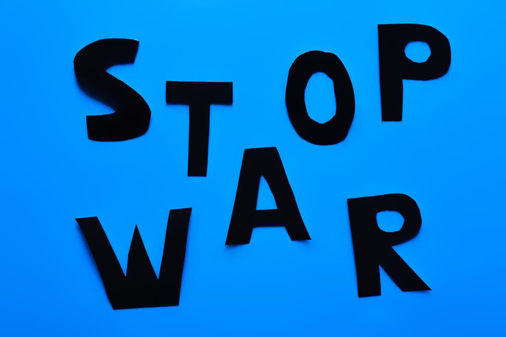 Mavi arkaplanda savaşı durdurma yazısının en üst görüntüsü  - Fotoğraf, Görsel