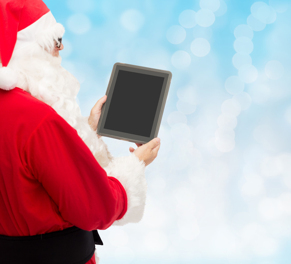 homme en costume de Père Noël claus avec tablette pc
 - Photo, image