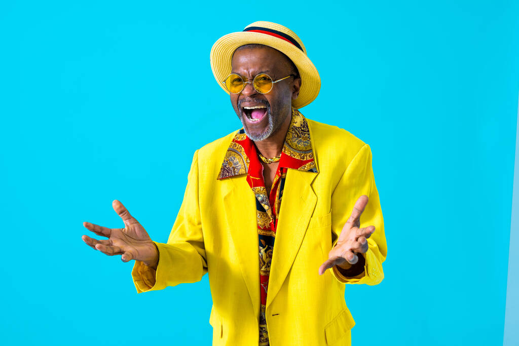 Cool senior man with fashionable clothing style portrait on colored background - Funny old male pensioner with eccentric style having fun - 写真・画像