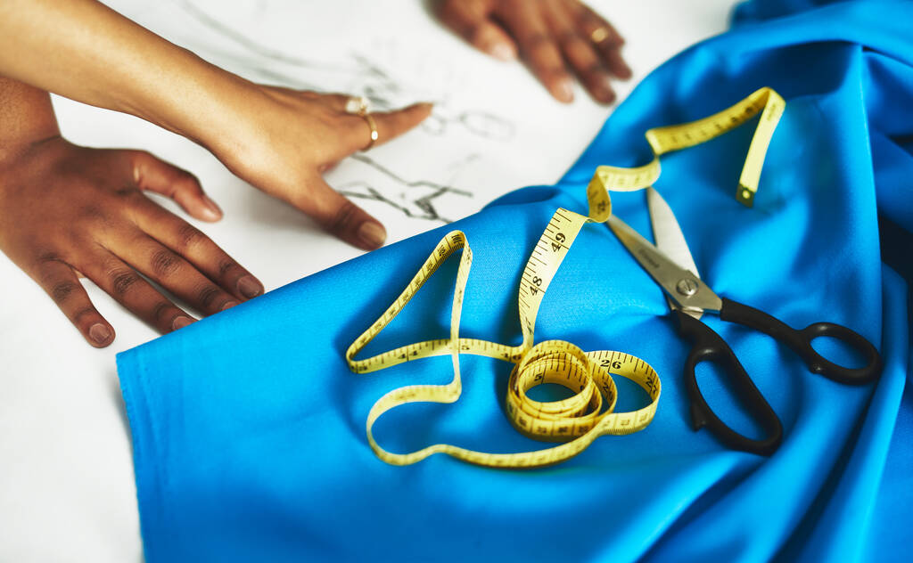 Its time to bring that dream to life. Cropped shot of fashion designers collaborating on a new design. - 写真・画像
