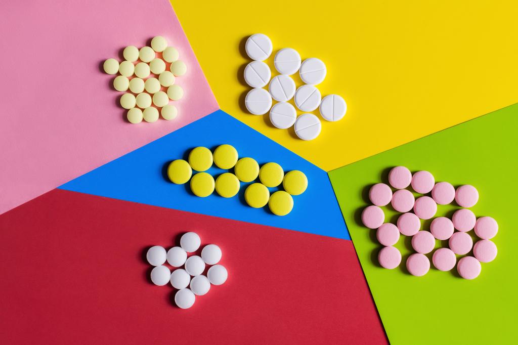 top view of different round shape pills on colorful background - Photo, image