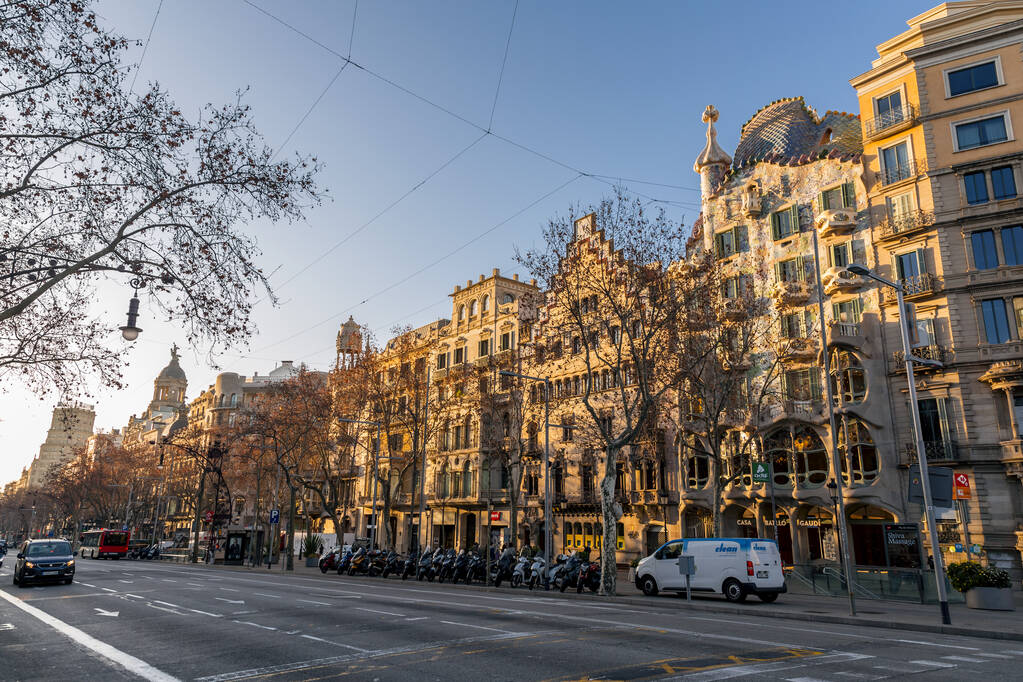 Barcelona, Spain - February 10, 2022: Buildings around the Passeig de Gracia, one of the main avenues in Eixample district of Barcelona, Spain. - Fotó, kép