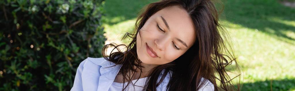 portrait of smiling and dreamy woman in park, banner - Foto, Imagem