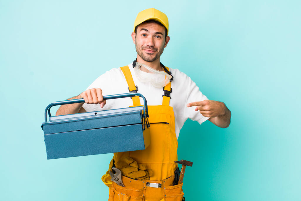 young adult man. plumber and toolbox concept - Photo, image