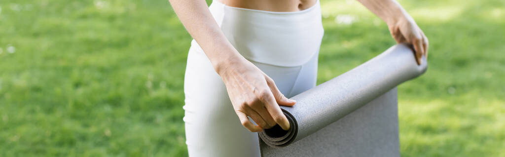 partial view of woman with fitness mat outdoors, banner - Fotoğraf, Görsel