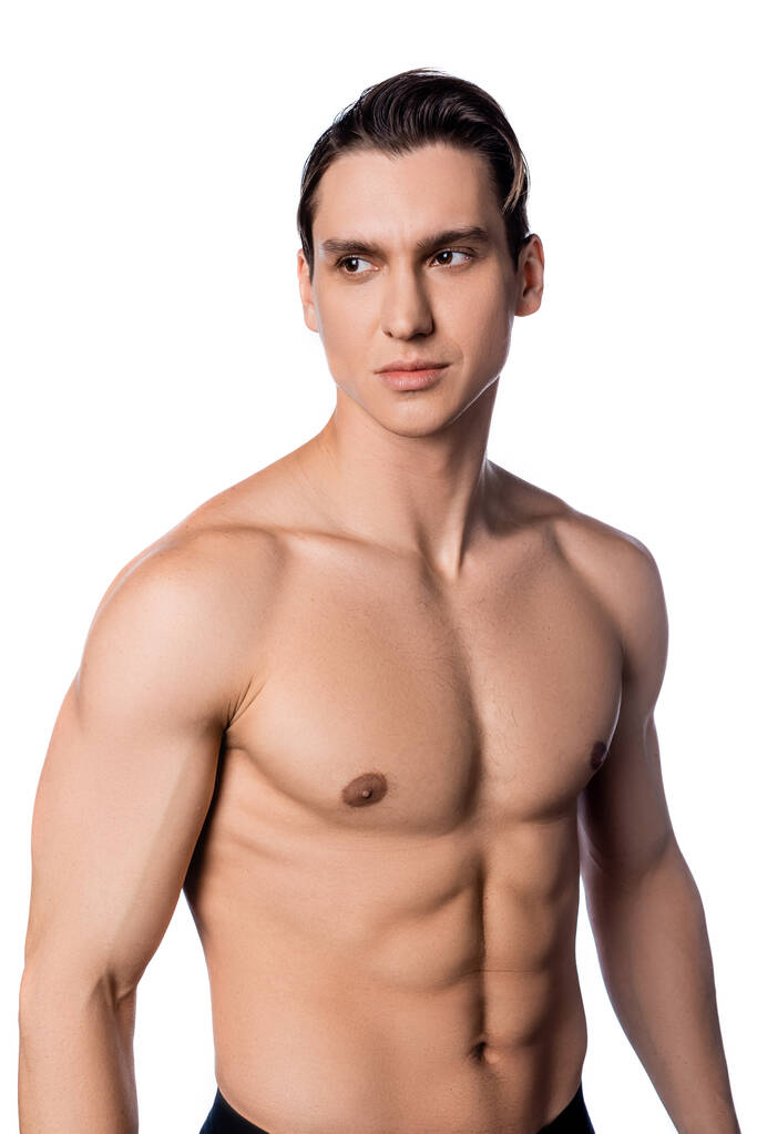 без рубашки мужчина с мускулистым телом и идеальной кожей глядя в сторону изолированы на белом - Фото, изображение