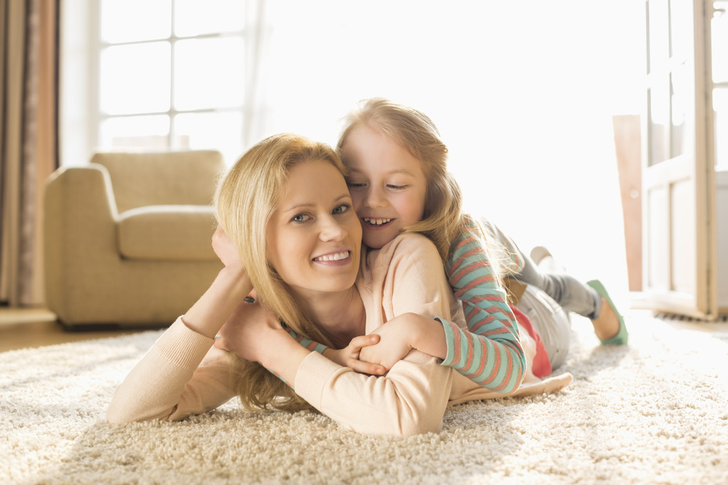 mother with daughter lying on floor - Photo, Image