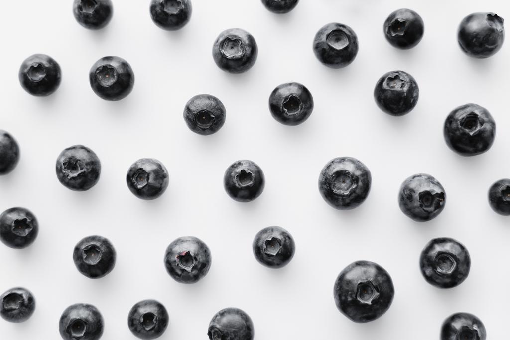 Flat lay of blueberries on white background - Photo, Image