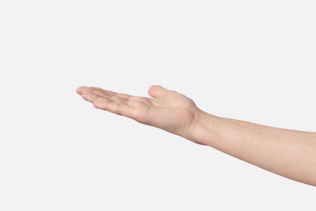 白い背景に隔離された完璧な肌の水平位置を持つ手のひらを請うか、手を伸ばす開いている女性. - 写真・画像