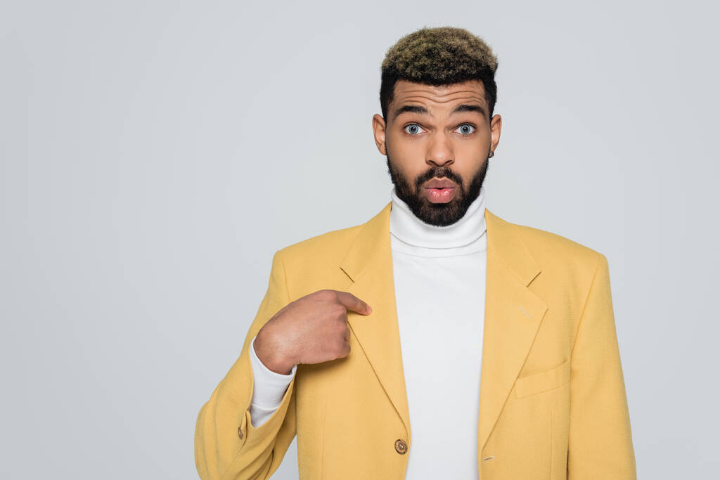 bearded african american man in turtleneck and yellow stylish blazer pointing at himself isolated on grey  - Photo, Image