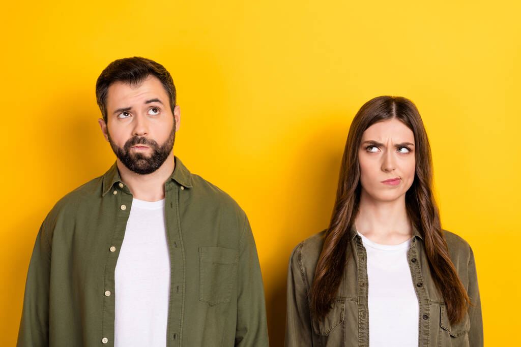 Photo of two minded focused people look interested empty space isolated on yellow color background. - Photo, Image