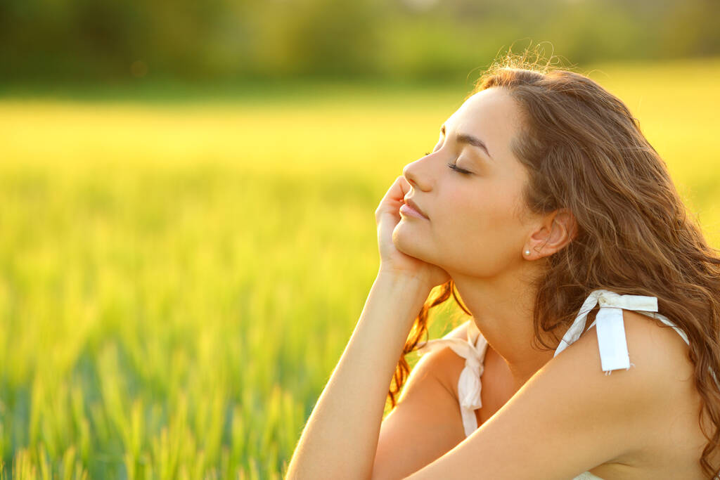 A következő profilja: relaxing mind with closed eyes sitting in a wheat field - Fotó, kép
