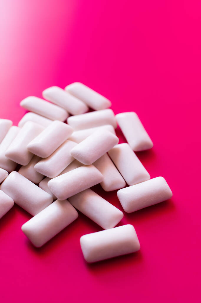Close up view of white chewing gums on pink background  - Photo, Image