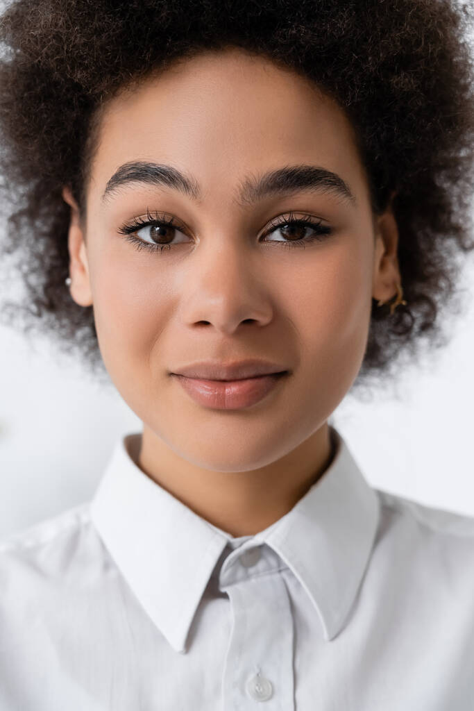 portrait of young african american woman in white shirt with collar  - Photo, Image