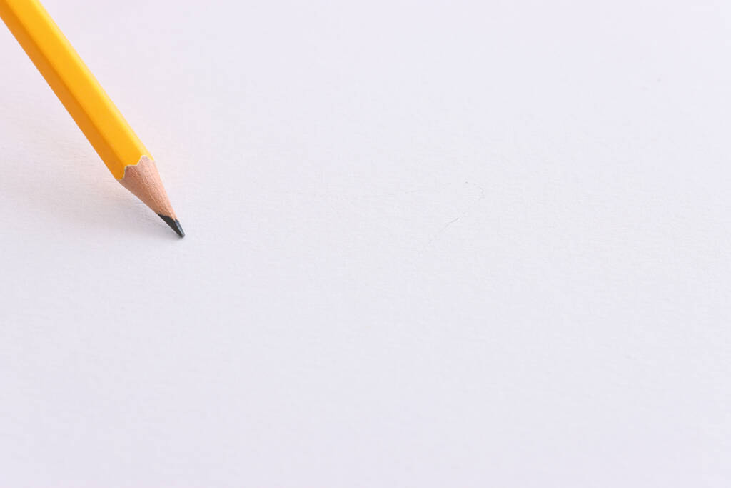 Bild von oben mit Bleistift über weißem strukturiertem Papier - Foto, Bild