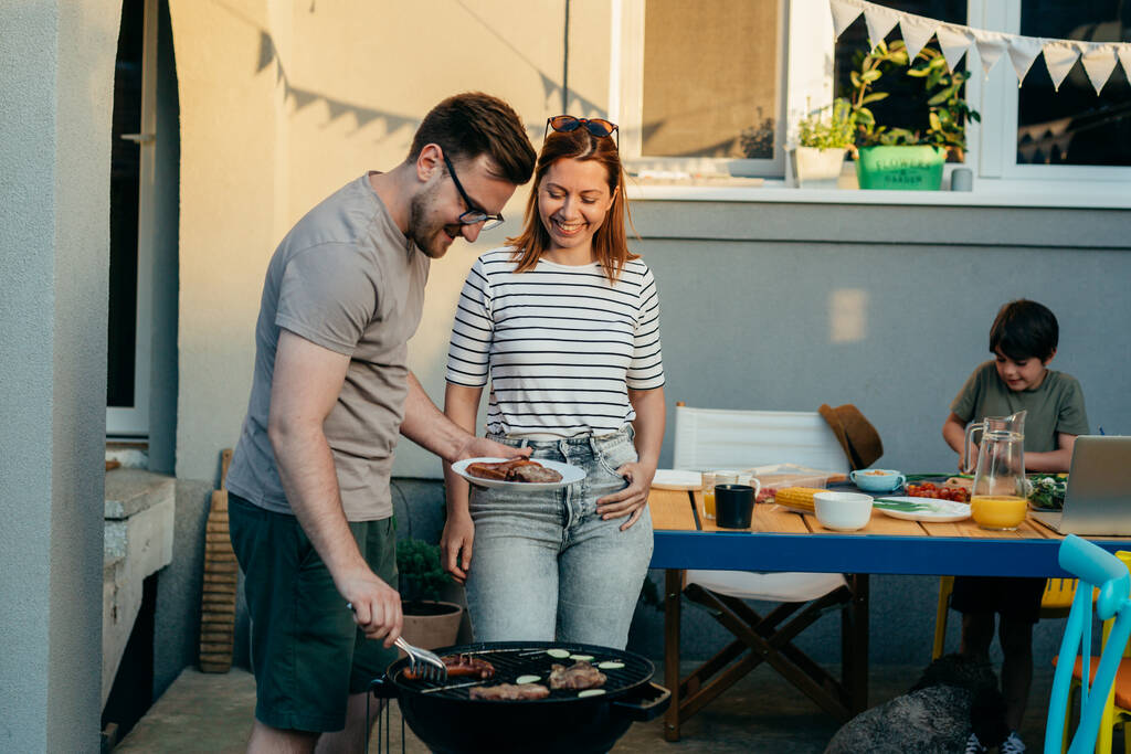 husband and wife grill barbecue in garden - Foto, Imagem