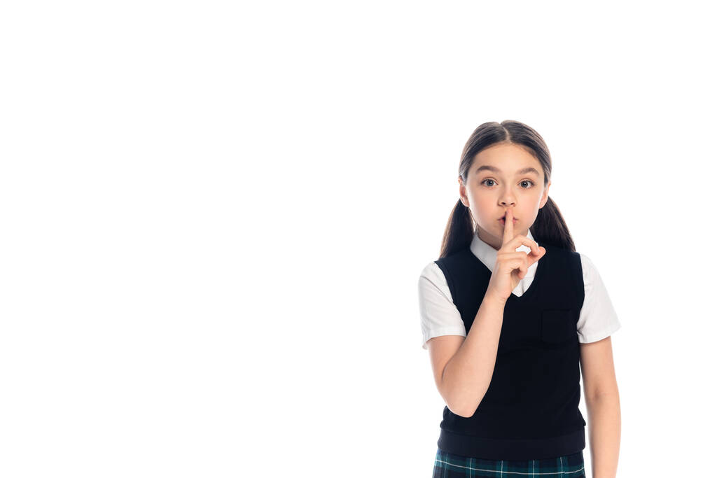 Schoolkid mostrando gesto segreto isolato su bianco  - Foto, immagini