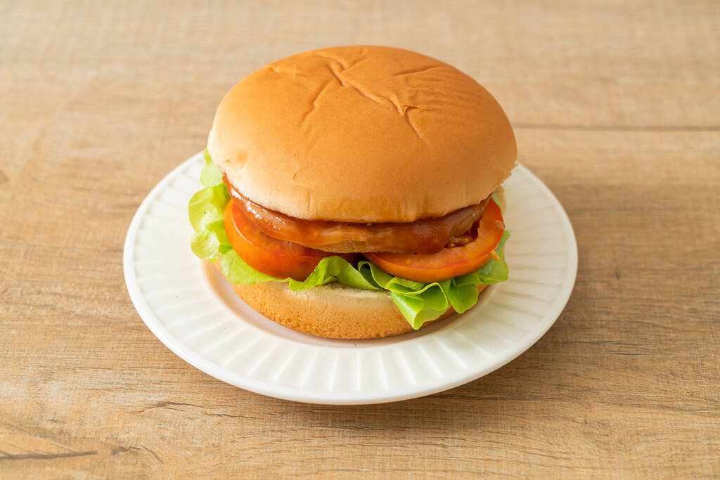 chicken burger with sauce on white plate - Photo, Image