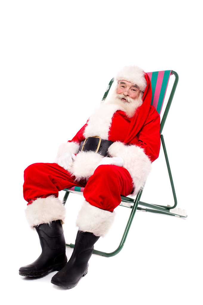 Рождественский папа сидит на стуле
 - Фото, изображение