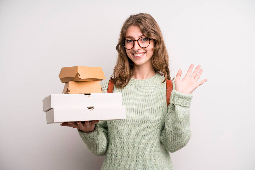young girl with pizzas and burgers. take away fast food concept - Zdjęcie, obraz